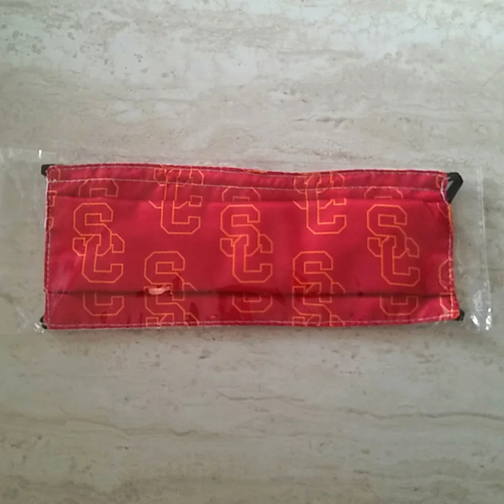 NWT USC Red/yellow pattern mask. One size.